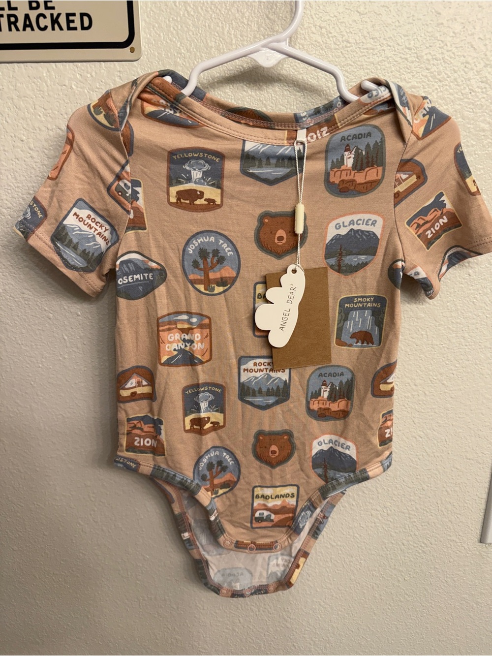 Angel Dear Tan National Parks Badge Print One-Piece